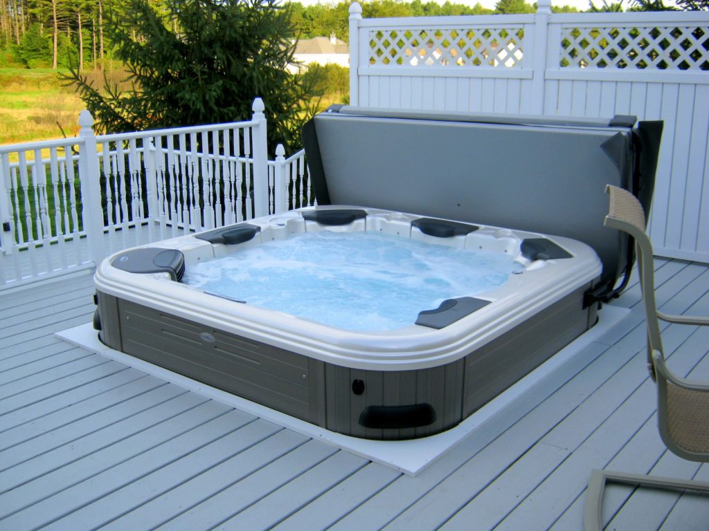 Compact energy-efficient outdoor spa hot tub with cover open
