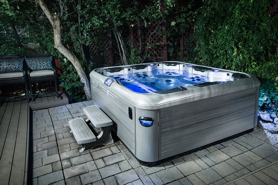 Pure Soak Spas luxury hot tub with hydrotherapy jets in backyard